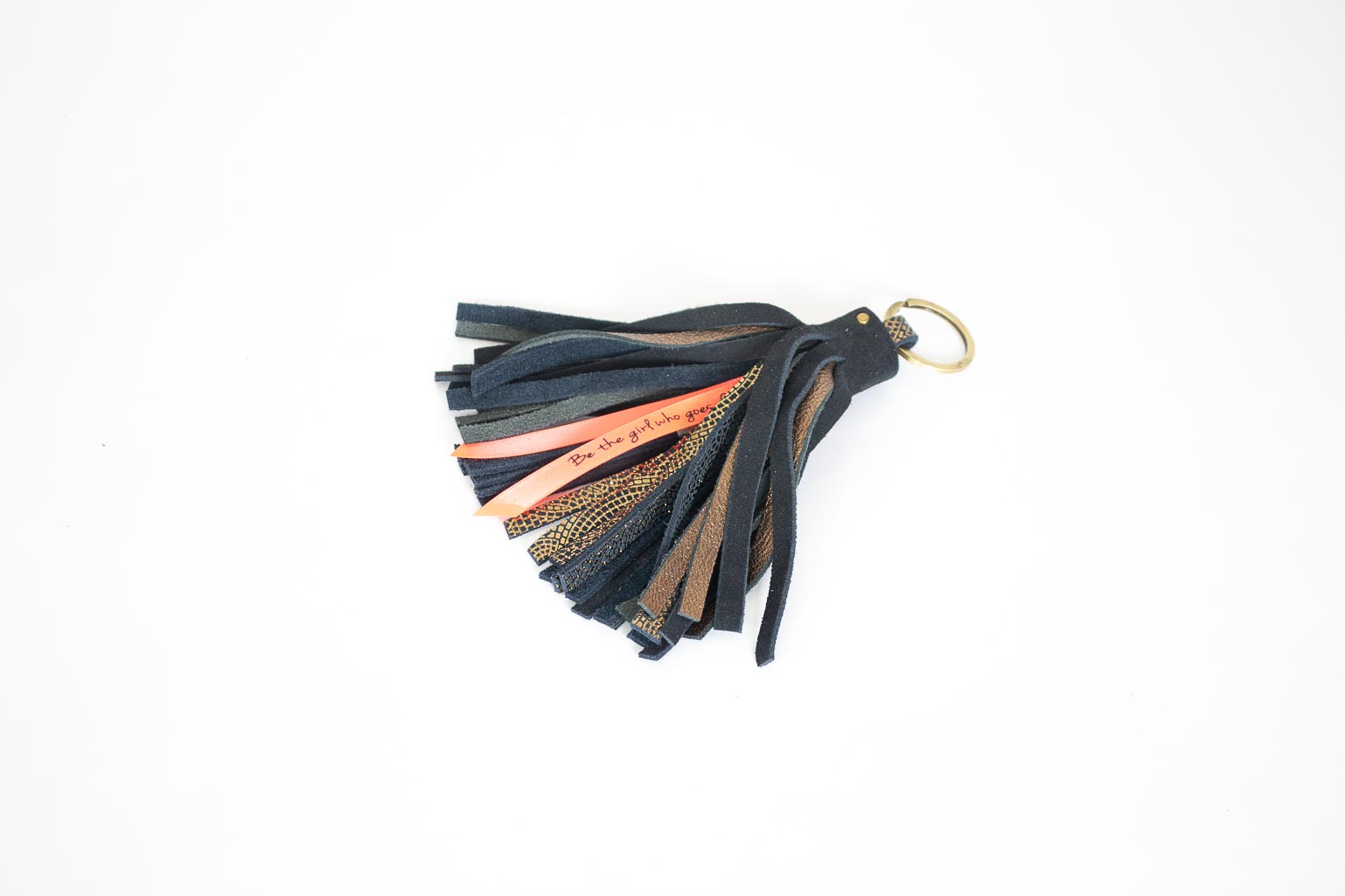 tassel-neon-quote-leather Keychain made of blue assorted pieces of leather.