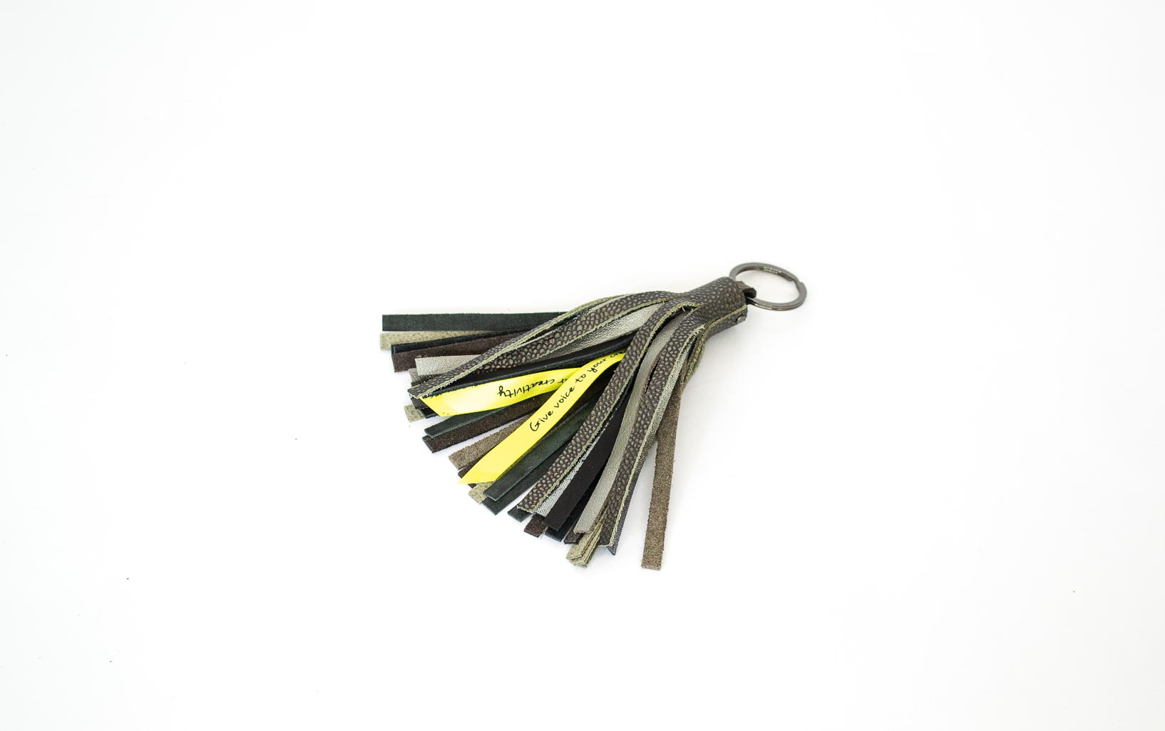 gray-textured-leather-keychain Tassel keychain made of grey and silver leather scaps.
