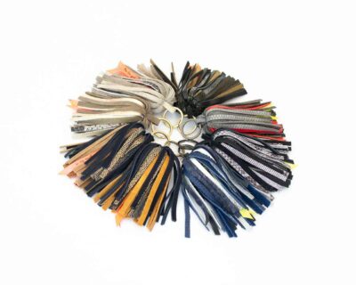 Pictures of leather keychain in a shape of a palm tree handmade by elphile.