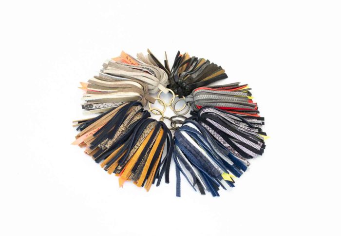 Pictures of leather keychain in a shape of a palm tree handmade by elphile.