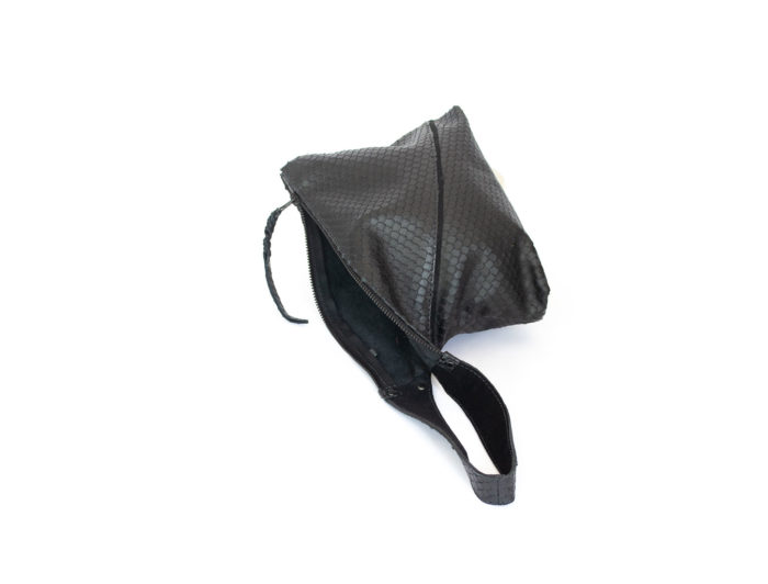 Close-up of the back of the Z clutch in black leather.