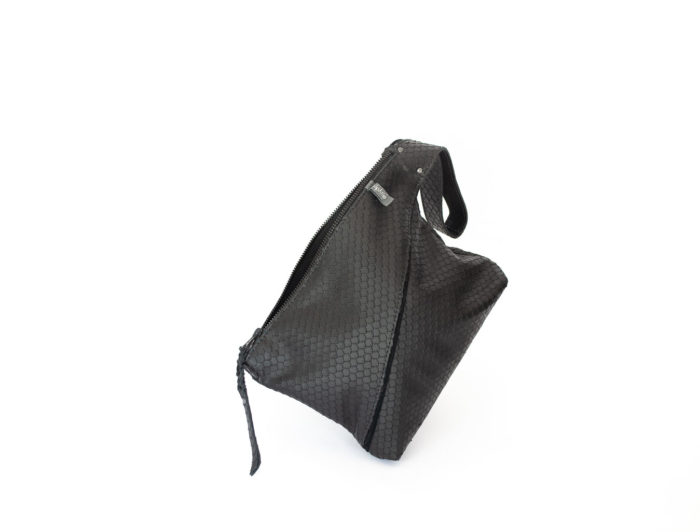 Picture of the front of the textured black Z clutch with a large zipper and handle.