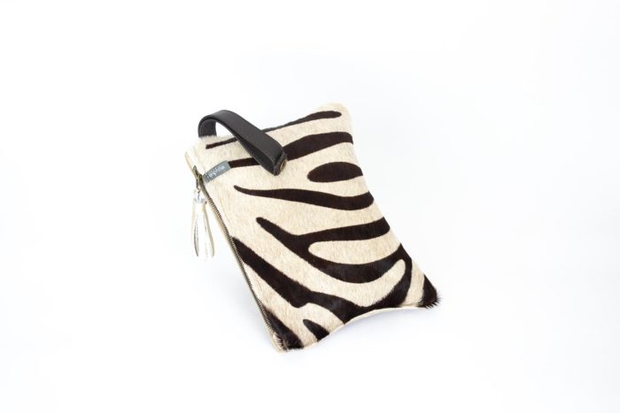Picture of a beige zebra animal print small evening bag.