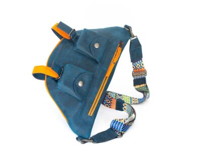 Picture of the front of the blue travel bag with its two front pockets and orange zipper..