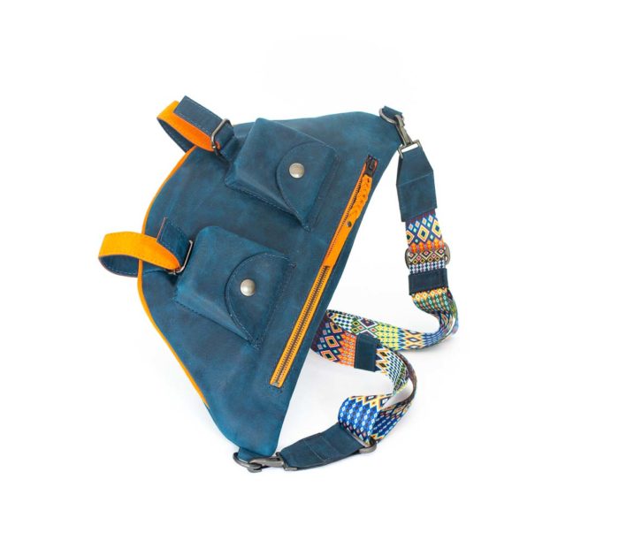 Picture of the front of the blue travel bag with its two front pockets and orange zipper..