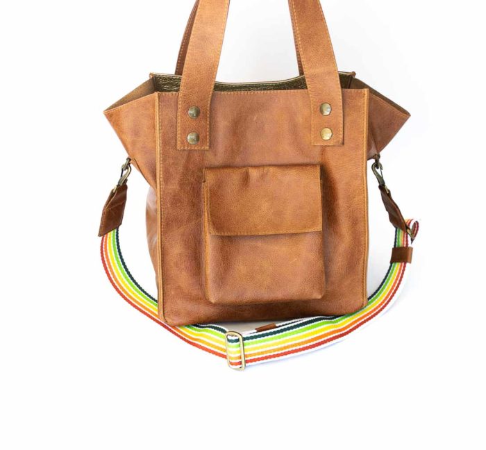 Picture of the cognac tote handbag with a rainbow strap.