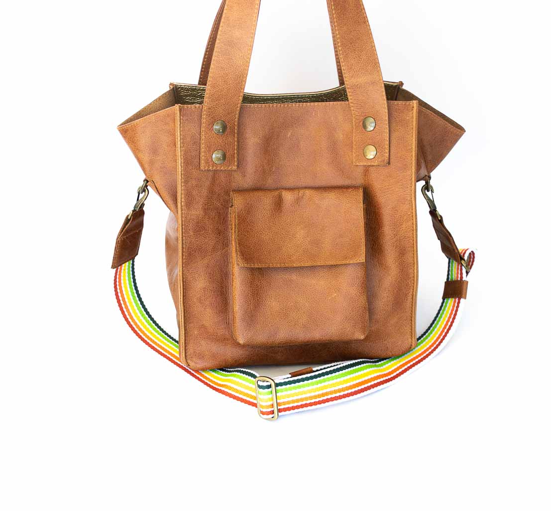 brown-shoulder-bag Picture of the cognac tote handbag with a rainbow strap.