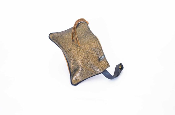 Picture of the front of the coin purse in paisley leather.