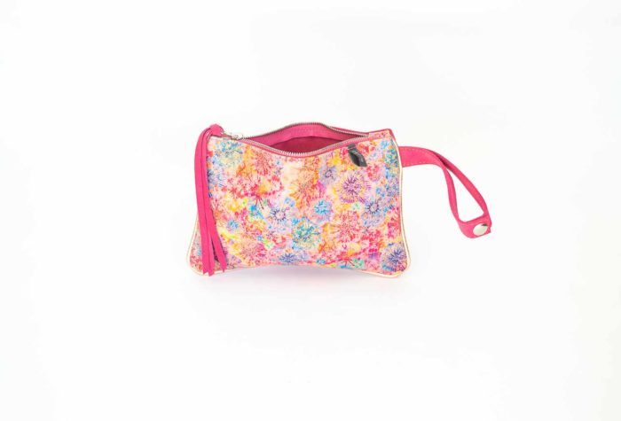 Picture of the tiny pink leather purse with zipper and wristlet.