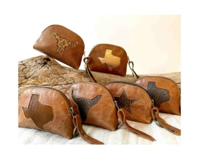 Bring up the color! Choose your fabric lining and leather combo to set the unique mini clutch with motif in leather